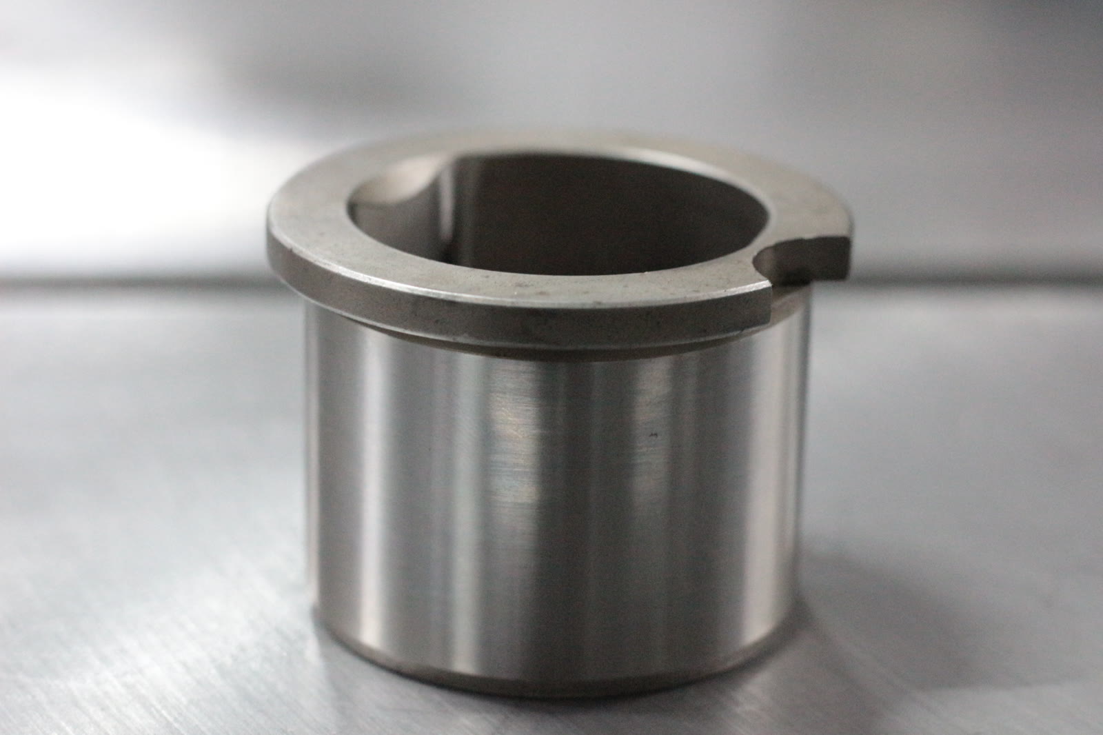 Finished precision-machined bushing component