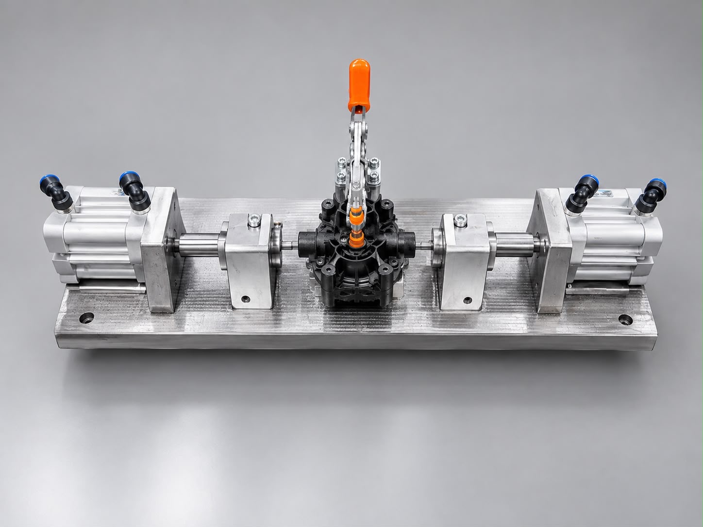 Custom machining fixture with opposed pneumatic cylinders and a mechanical clamp